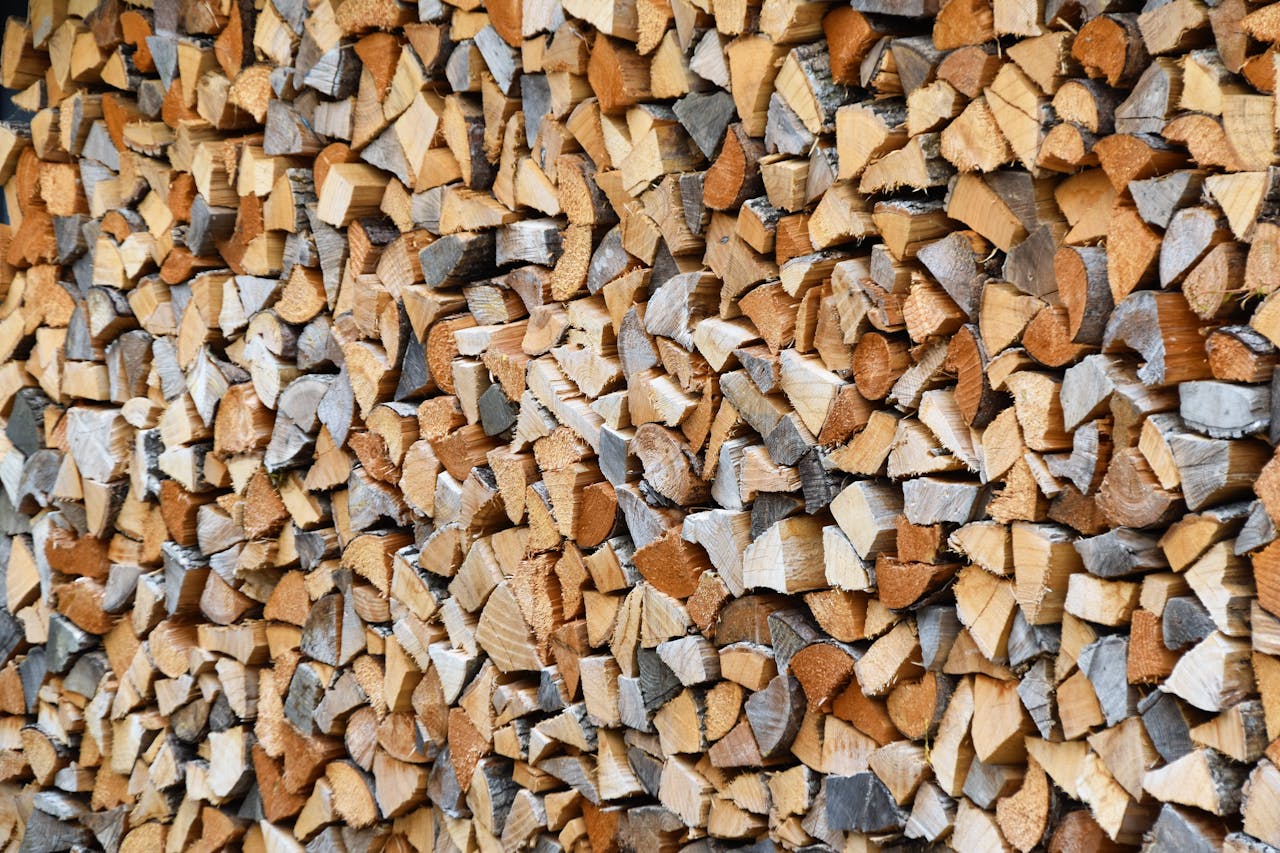 Neatly arranged stack of split firewood, perfect for cold winter days.